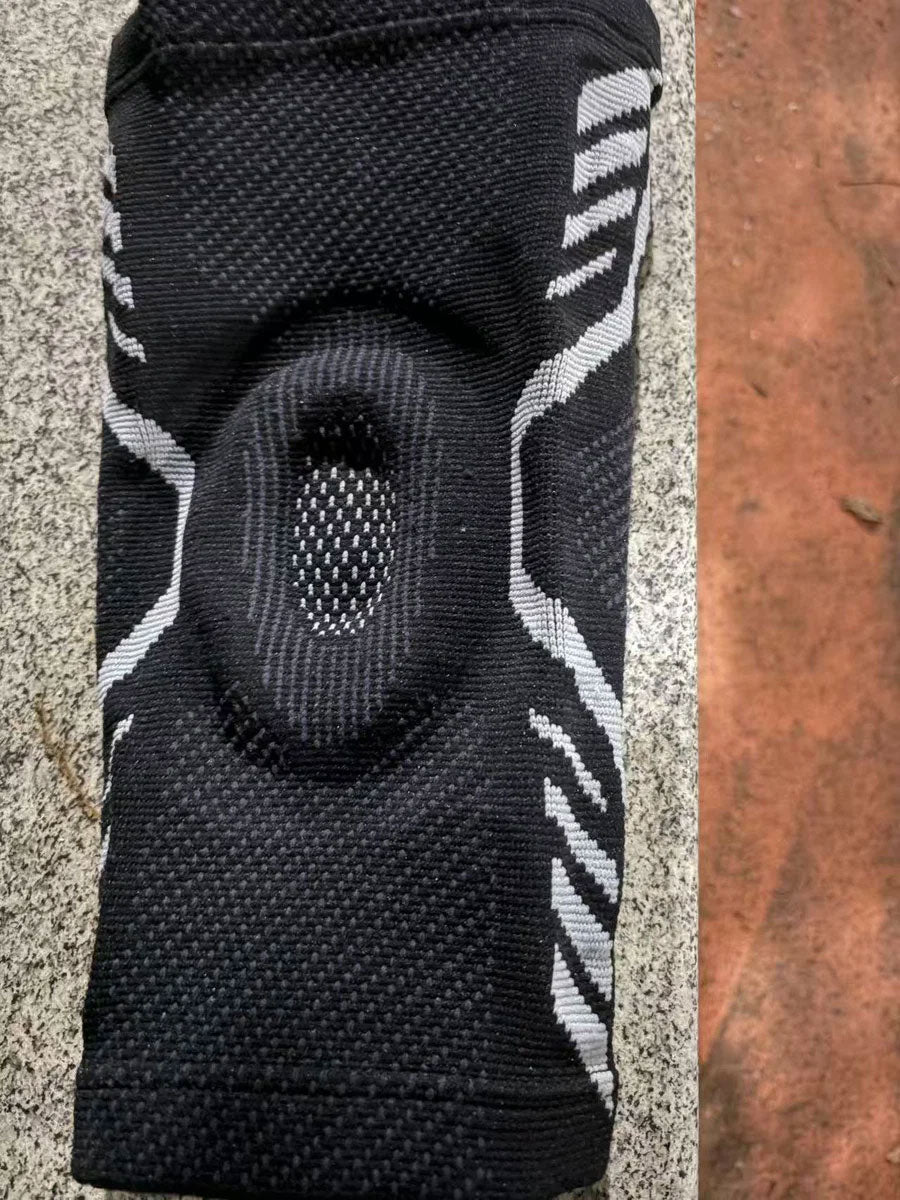 Close-up of a black TEVANLY Active Compression Knee Support Sleeve showing its knit texture and patella padding.