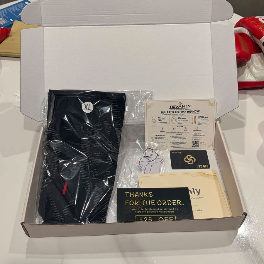 Open TEVANLY package containing a black Adjustable Compression Knee Brace, instructions and a thank-you card.